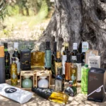 selection of healthy evoos in bottles under the olive tree