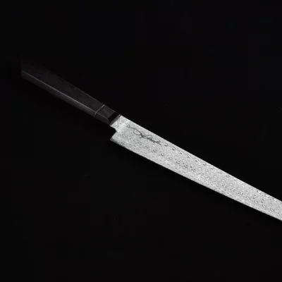 Full view of the Skelmis Sujihiki Sakimaru, showcasing its high-quality handmade damascus steel blade and ergonomic handle.