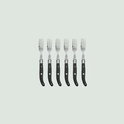 Close-up of Laguiole steak fork with wood handle and polished bolster