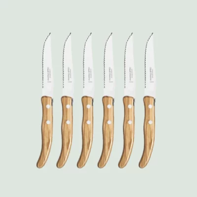 Close-up of steak knife handle in rich Mediterranean olive wood
