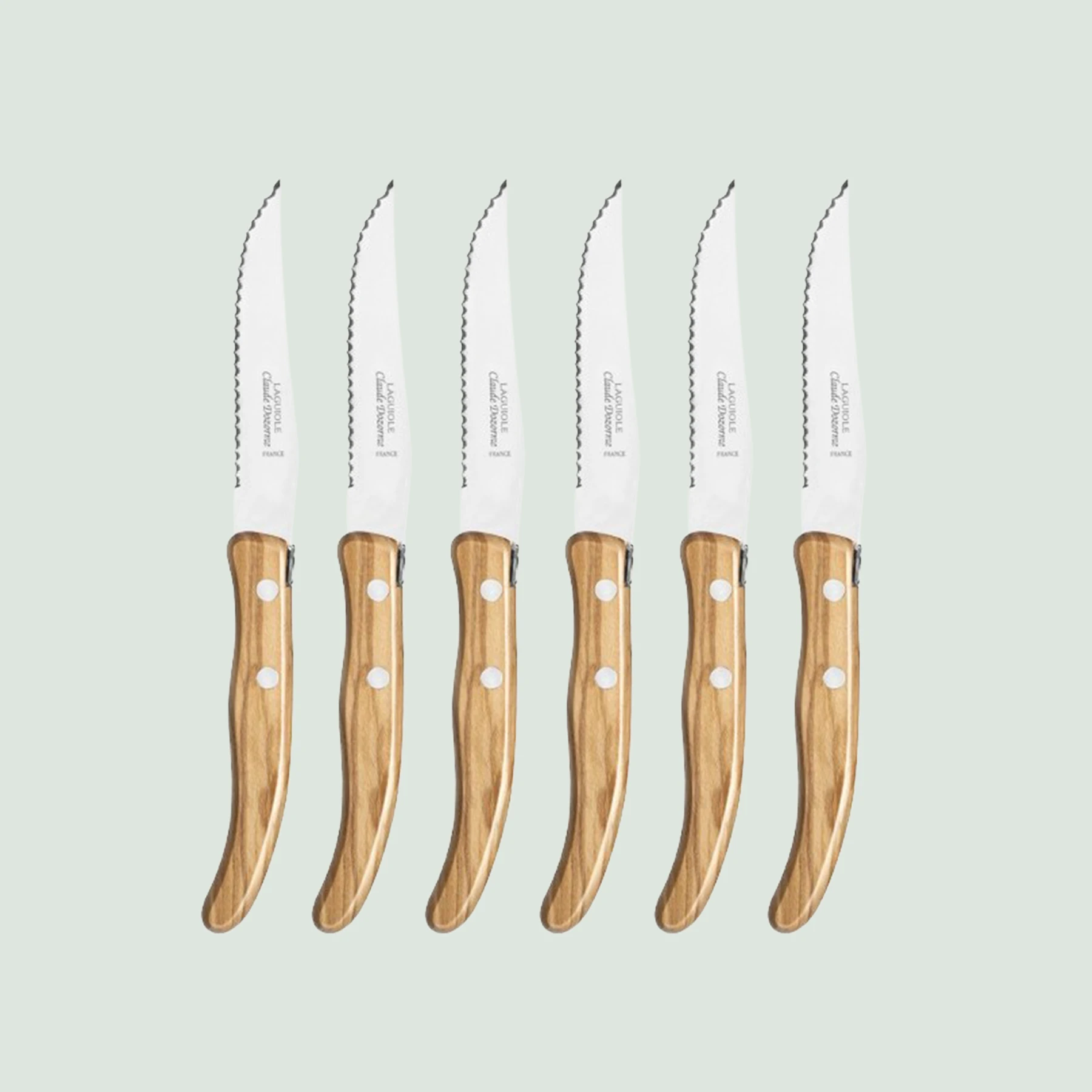 Close-up of steak knife handle in rich Mediterranean olive wood
