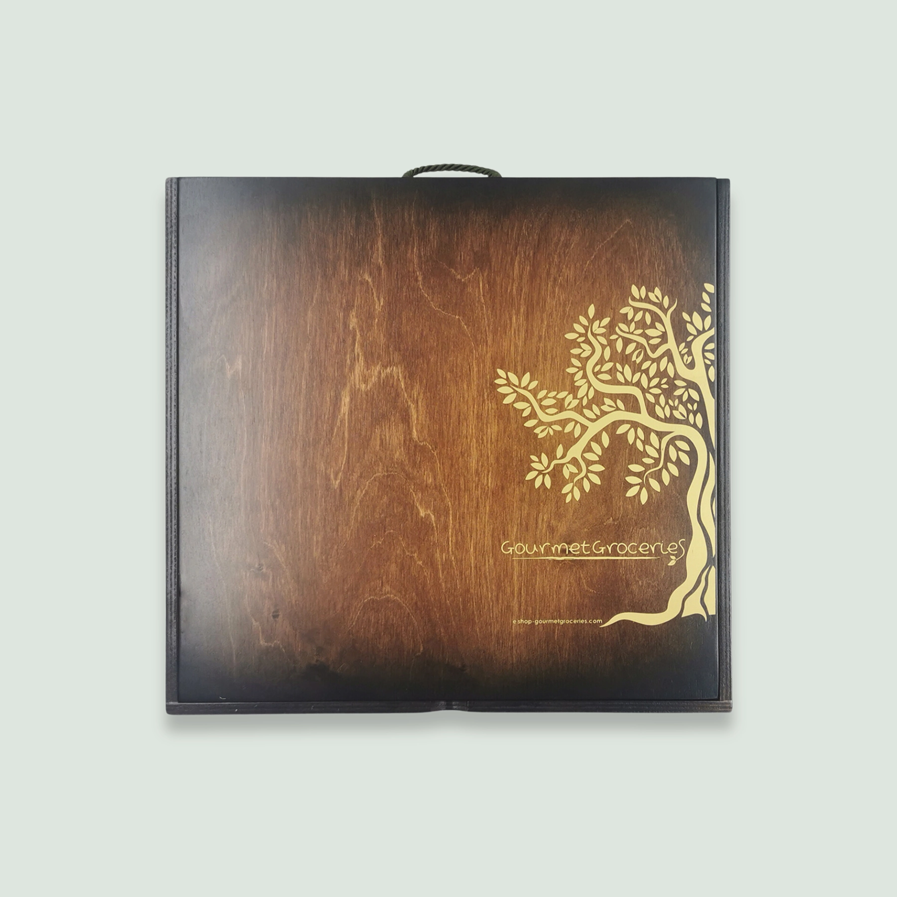 The exterior of a wooden gift box with a dark finish. The box features a golden tree logo and the text "Gourmet Groceries" along with the website "shop.gourmet.wearedoubledot.com."