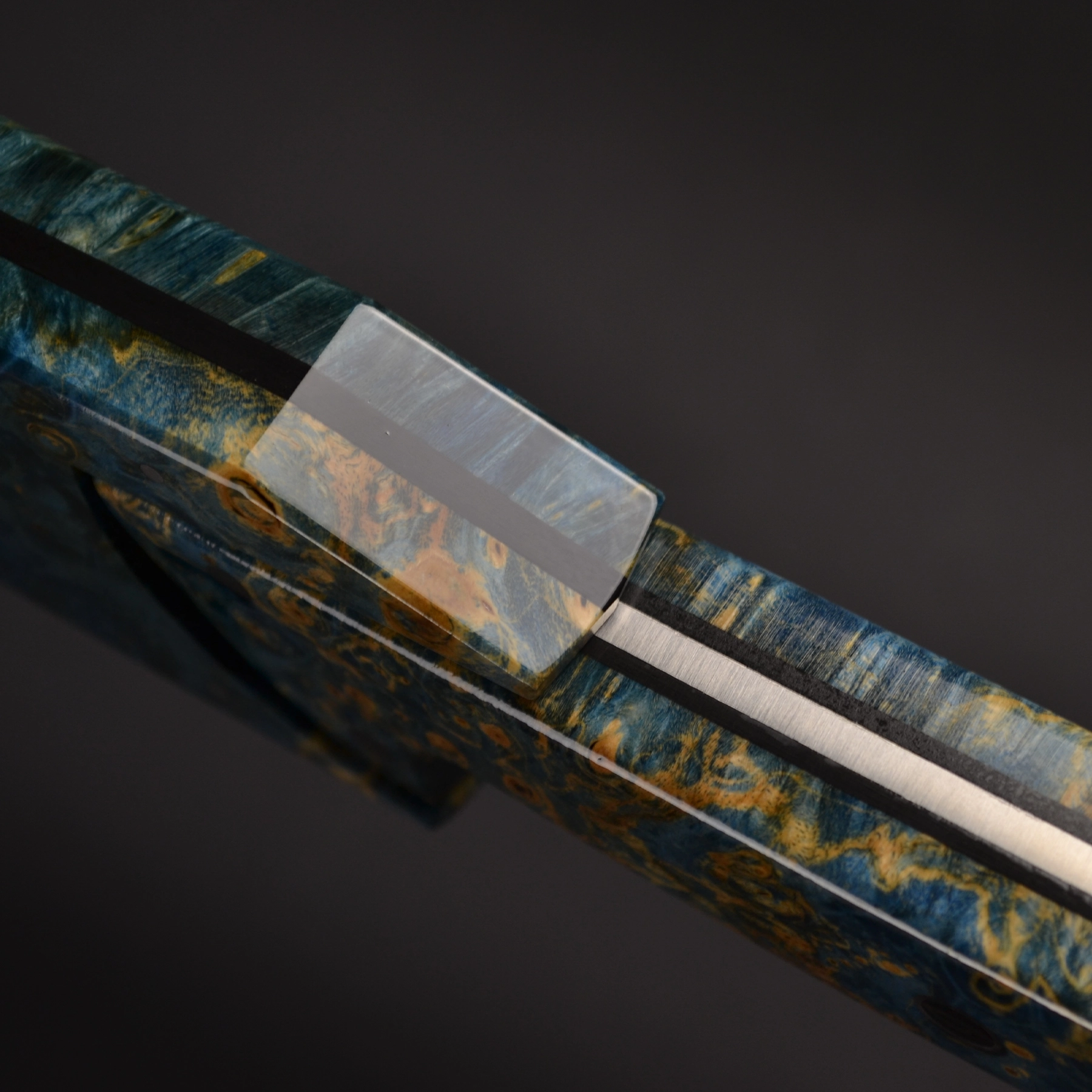 Detailed close-up of the 61 HRC hardness stainless steel blade