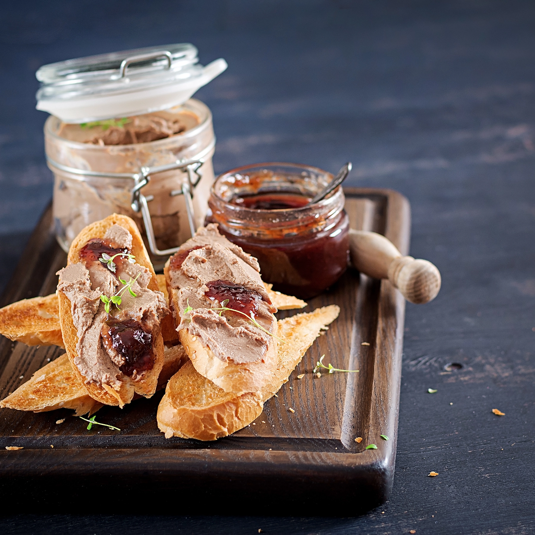 A gourmet platter featuring Royal Pate Foie Gras served with slices of fresh baguette