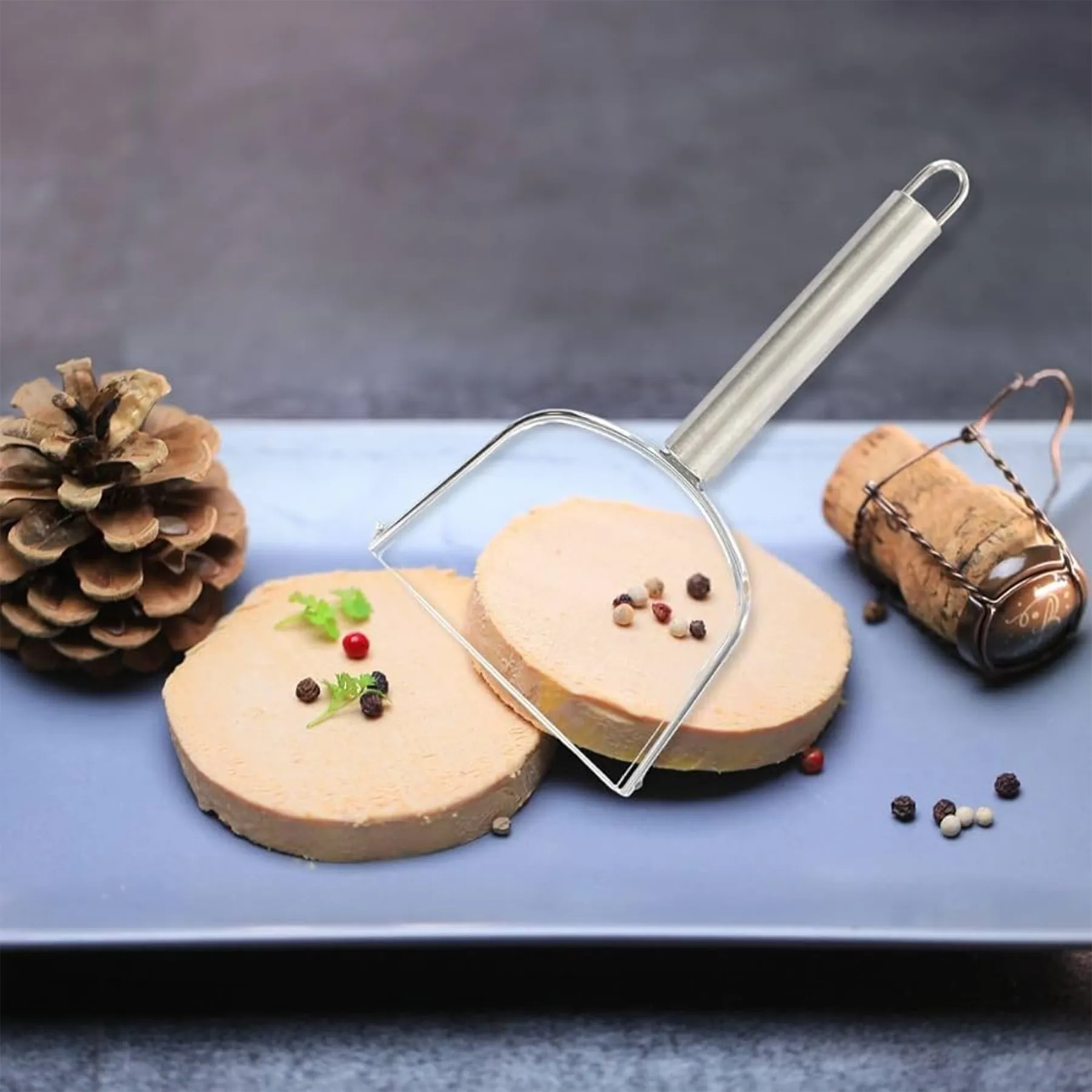 Wire foie gras cutter making clean slices on a block of foie gras