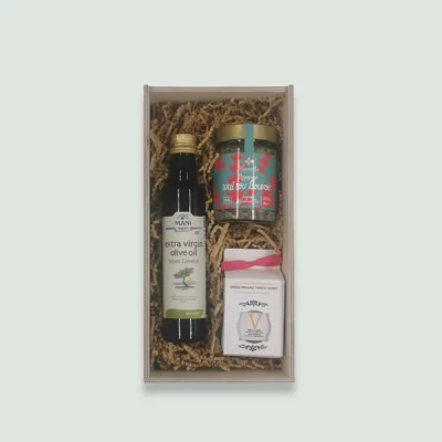 a healthy gift box containing luxury organic Greek Evoo, vasilissa organic raw honey, and organic herbs or essential oils from Lavandia.