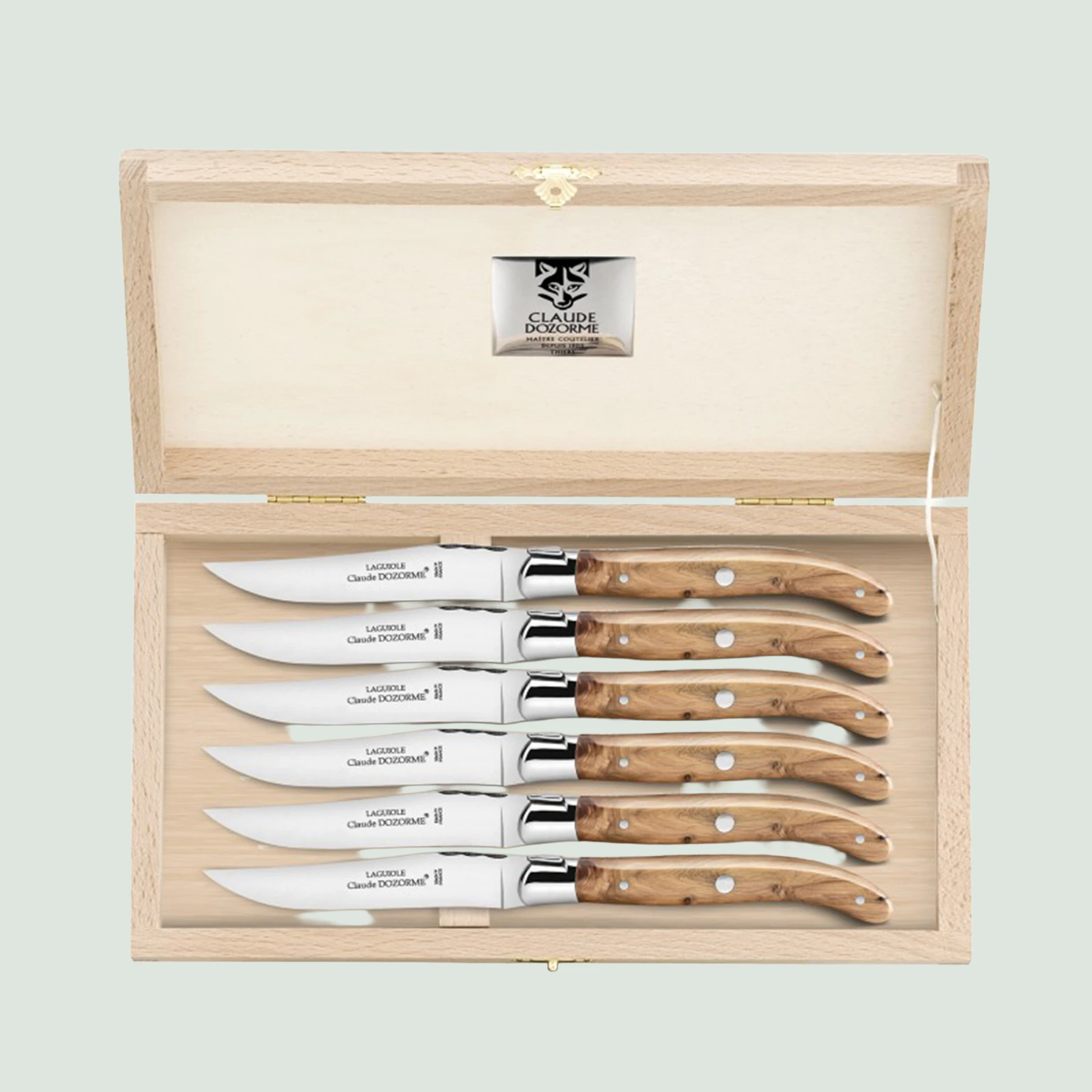 Claude Dozorme Laguiole steak knives in open beech wood box