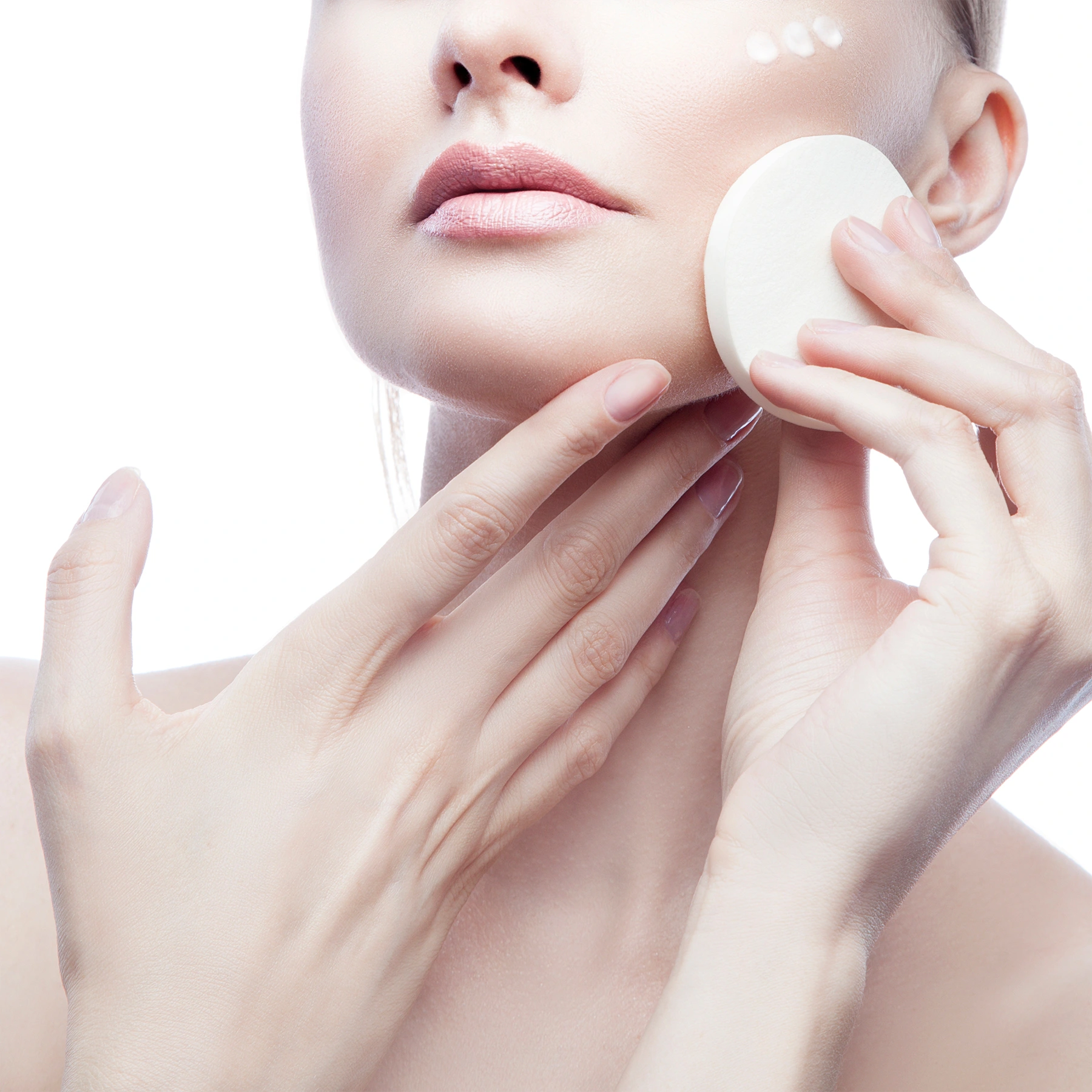 Woman applying Olium Make-Up Remover on her face, showcasing its smooth texture and gentle formula.
