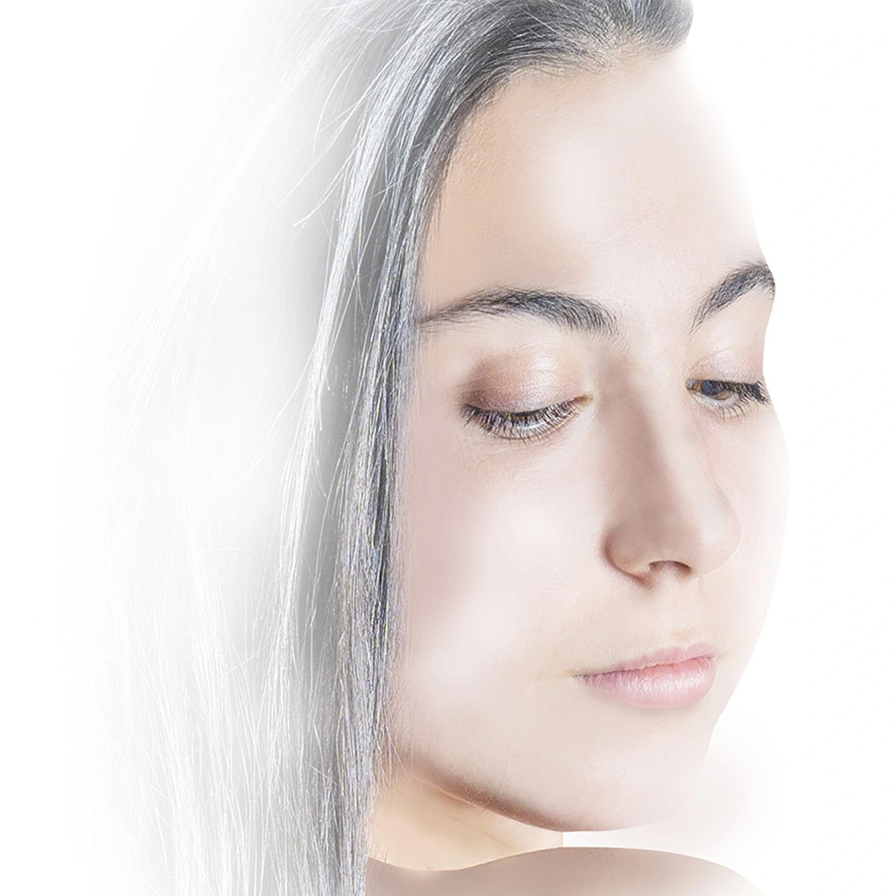 A woman applying OLIAURA Repairing and Toning Face Cream to her face, demonstrating the product's smooth texture and hydrating properties.
