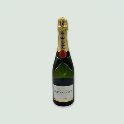 Front view of Moët Impérial Champagne bottle with golden label.