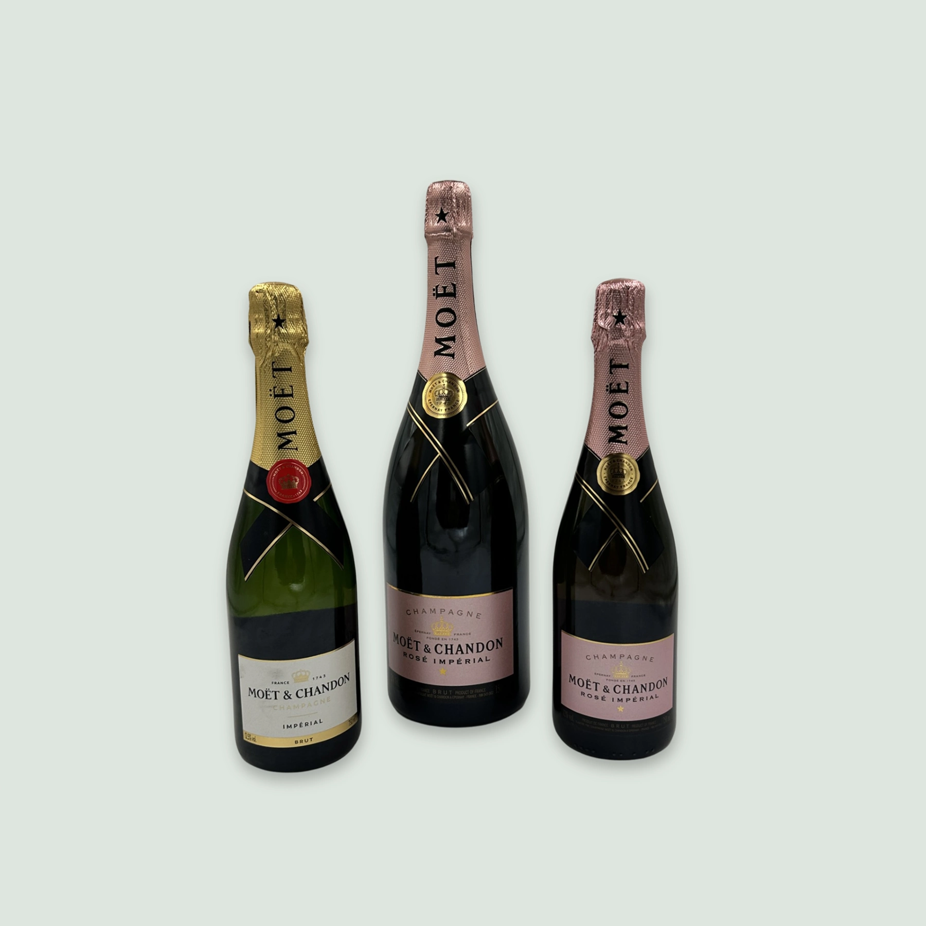 Moët Rosé Impérial Champagne bottle displayed alongside Moët Impérial Champagne bottle.