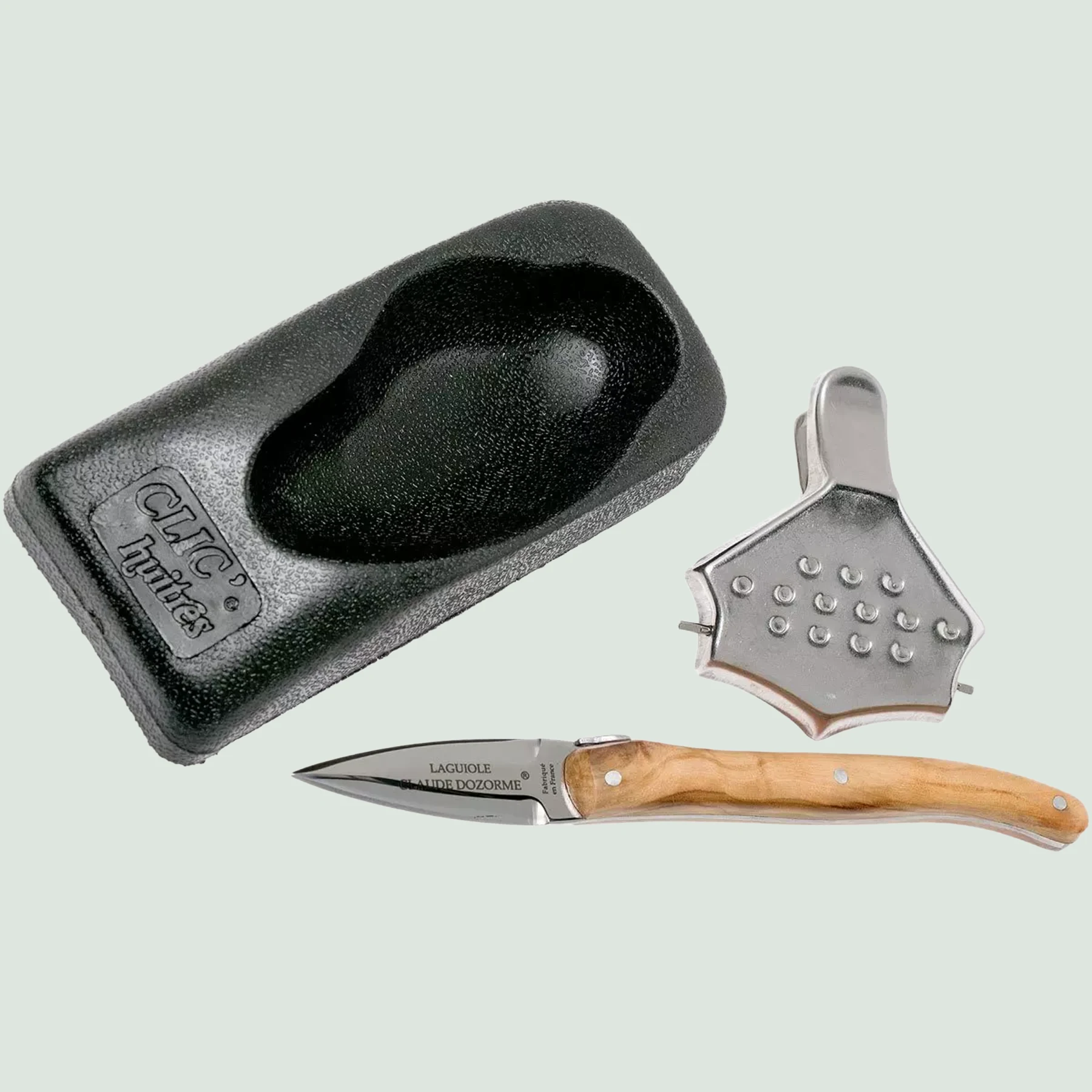 Close-up of Laguiole oyster knife with olive wood handle and matte stainless steel bolsters