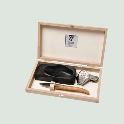 Complete oyster knife set with lemon squeezer, oyster holder, and wooden box by Claude Dozorme