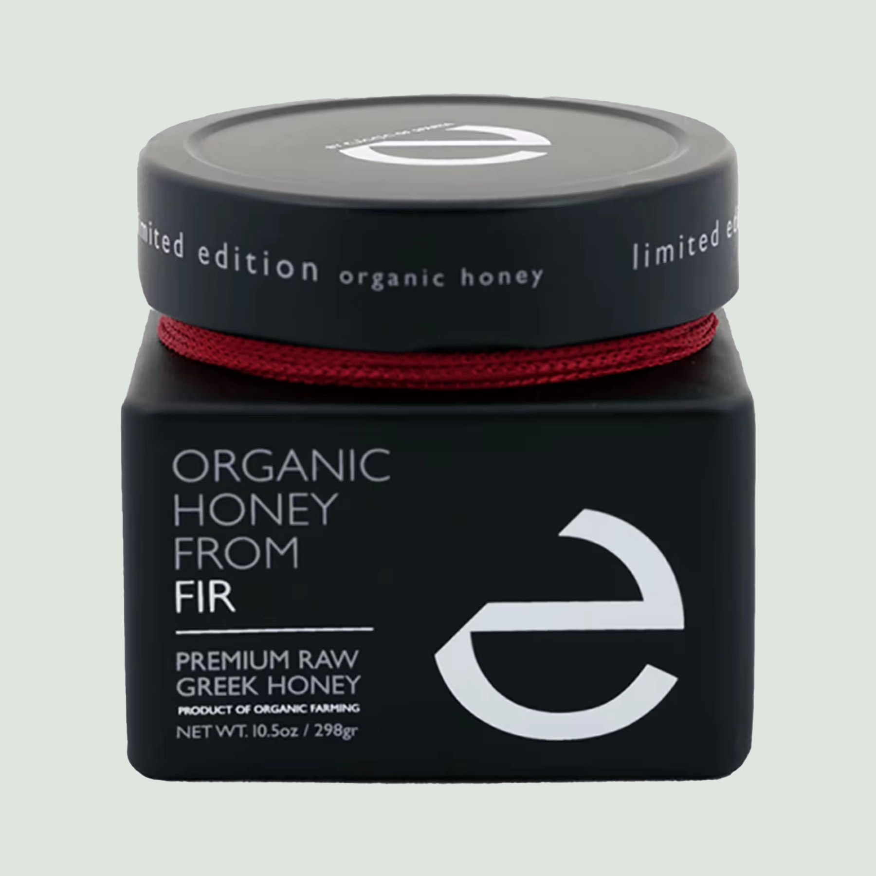 Close-up of the front label of Eulogia’s Premium Organic Fir Honey, showcasing the luxurious 250g jar with elegant branding and details.