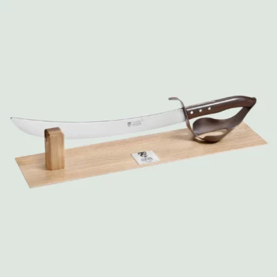 Design champagne saber with green rosewood handle on oak display stand