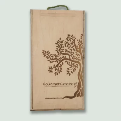 A closed Gourmet Groceries gift box, showing the company logo and website link.