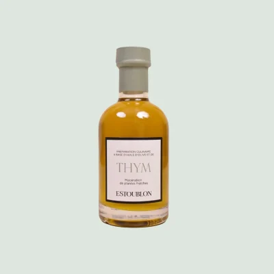 Thyme-infused olive oil bottle with delicate herbal notes and aromatic Mediterranean essence