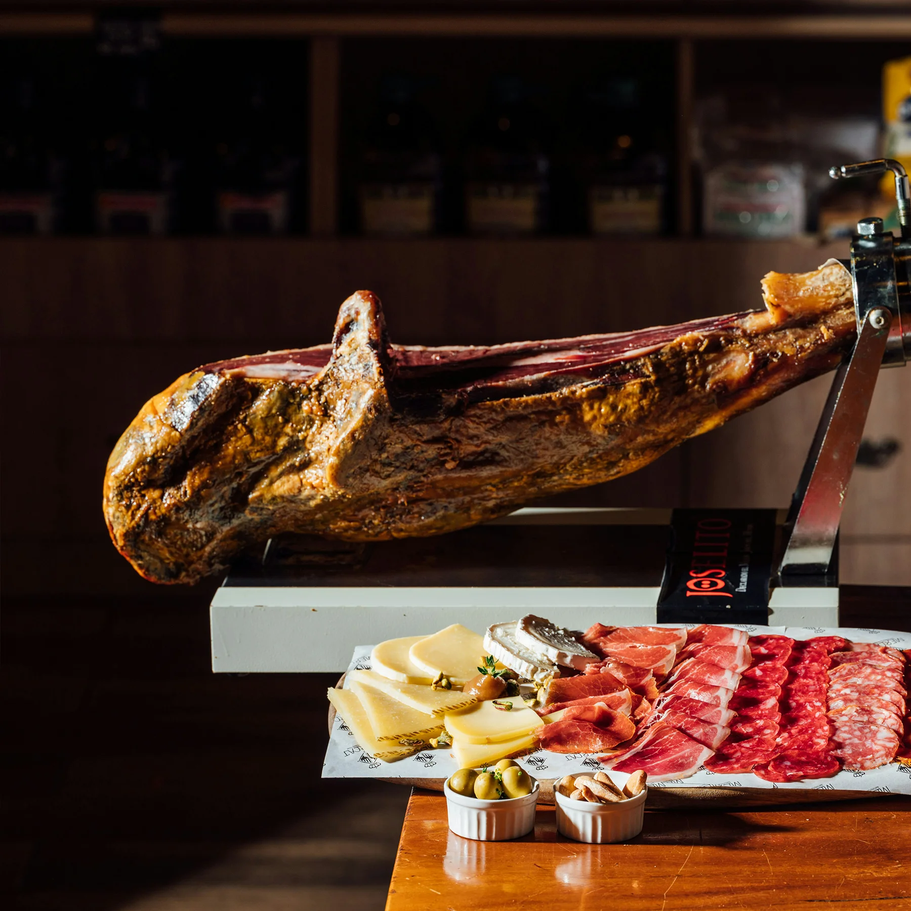 Close-up of Jamón Gran Reserva showing texture, fat distribution, and rich golden hues