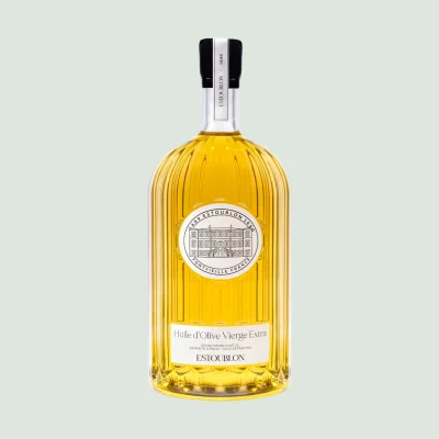 Large 4.5L extra virgin olive oil bottle displayed on dining table