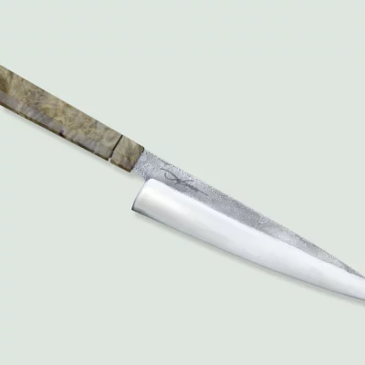 Handmade Pandion Gyuto knife with a high-carbon steel blade and ergonomic handle.
