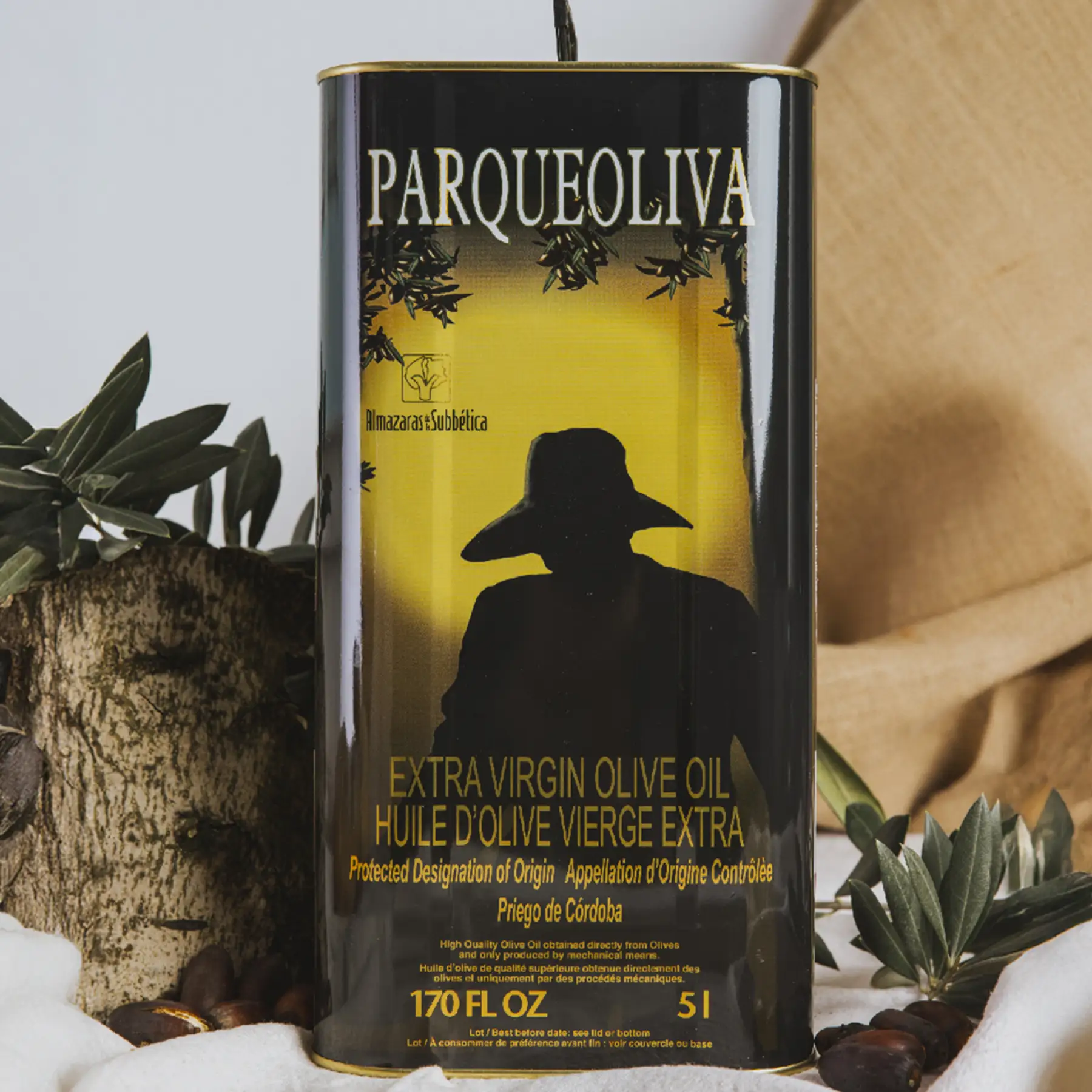 Premium organic extra virgin olive oil by Almazaras de la Subbética displayed on marble surface