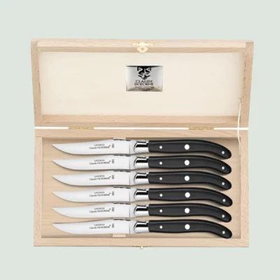Open beech wood box displaying six handcrafted Laguiole steak knives