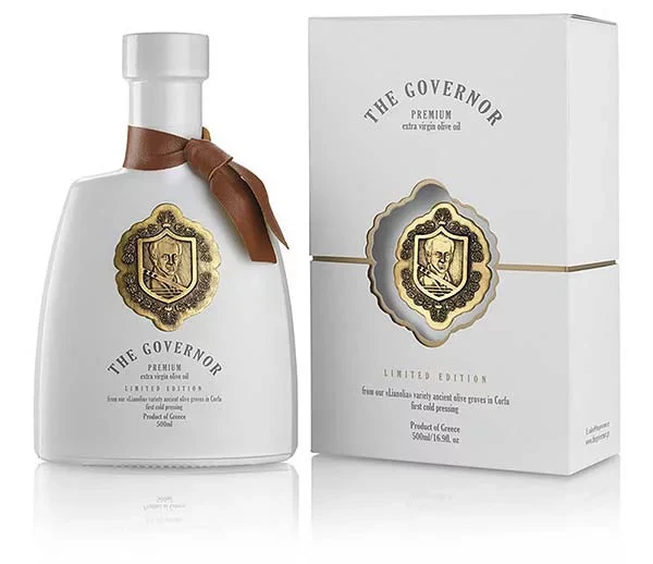 A bottle of The Governor Premium Extra Virgin Olive Oil alongside its premium packaging, highlighting the exceptional quality and health benefits.