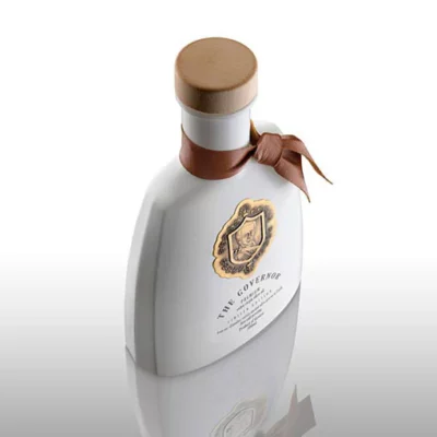 A bottle of The Governor Premium Olive Oil showcasing the elegant packaging and high-quality oil made from rare Lianolia olives.