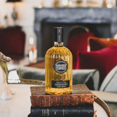 Luxury olive oil bottle styled on fine dining table setting